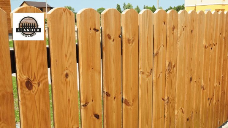 new wooden picket fence
